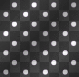 White Polka Dots On a black Background